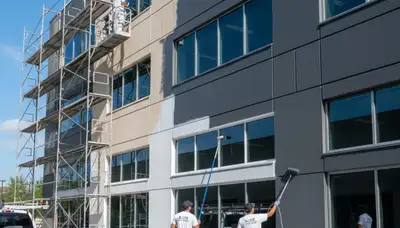 Professional commercial painters working on office exterior in Fort Wayne, IN