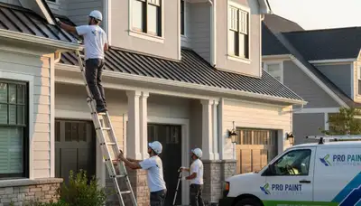 Professional gutter painting on a Fort Wayne IN home by expert house painters for curb appeal